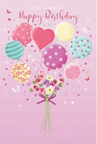 A pastel birthday fantasy drifts across a blush-pink background, as if a small celebration were rising above the rooftops near Valentines Park in Ilford. At the centre, a cluster of balloons gathers into a dreamy bouquet, their rounded and heart-shaped forms overlapping in soft layers. Each balloon carries its own charm: some are ringed with spiralling, candy-like stripes, others are dotted with joyful polka spots, and a few are washed with gentle ombré tones that shift from sea-green to pink and buttery yellow. These airy shapes seem to lift a dainty floral bouquet beneath them, transforming the flowers into a floating gift. The blooms themselves are tender and abundant, with roses and anemone-like blossoms in shades of ivory, blush, and muted mauve, their petals appearing feathery and touchable, as if they had just been conditioned in cool water at a local Ilford shop. A rich violet satin bow hugs the stems at the base, its knot neat and polished, catching the light with a subtle sparkle. Around the arrangement, tiny stars and butterfly silhouettes scatter like confetti on the breeze along Cranbrook Road, adding a whisper of fairy-tale magic. The illumination is soft, as though coming from an unseen window, gliding over the glossy balloons and lending each petal a gentle, natural sheen. The overall impression is light, airy, and perfectly festive-an image that captures the feeling of sending a birthday bouquet to someone special in Ilford, where colour, craftsmanship, and thoughtfulness come together in one uplifting moment.